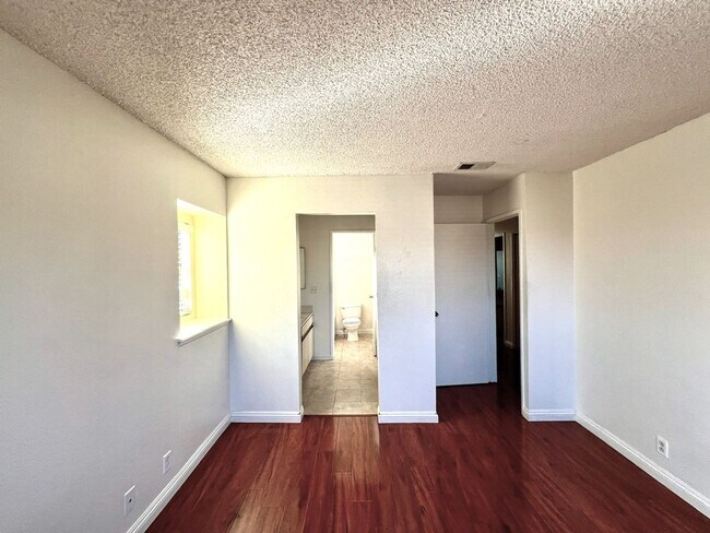 Building Photo - 2 Bedroom, 2 Bath Upstairs Condo with Private Balcony & 2-Car Garage, Gated Community, Water/Tras...