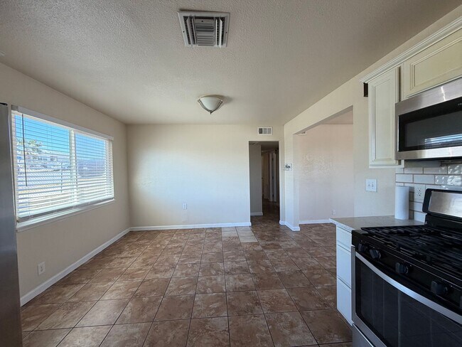 Building Photo - 3 Bedroom 2 Bathroom House with Central A/C , 2 Car Garage and Beautiful Backyard with Covered Patio