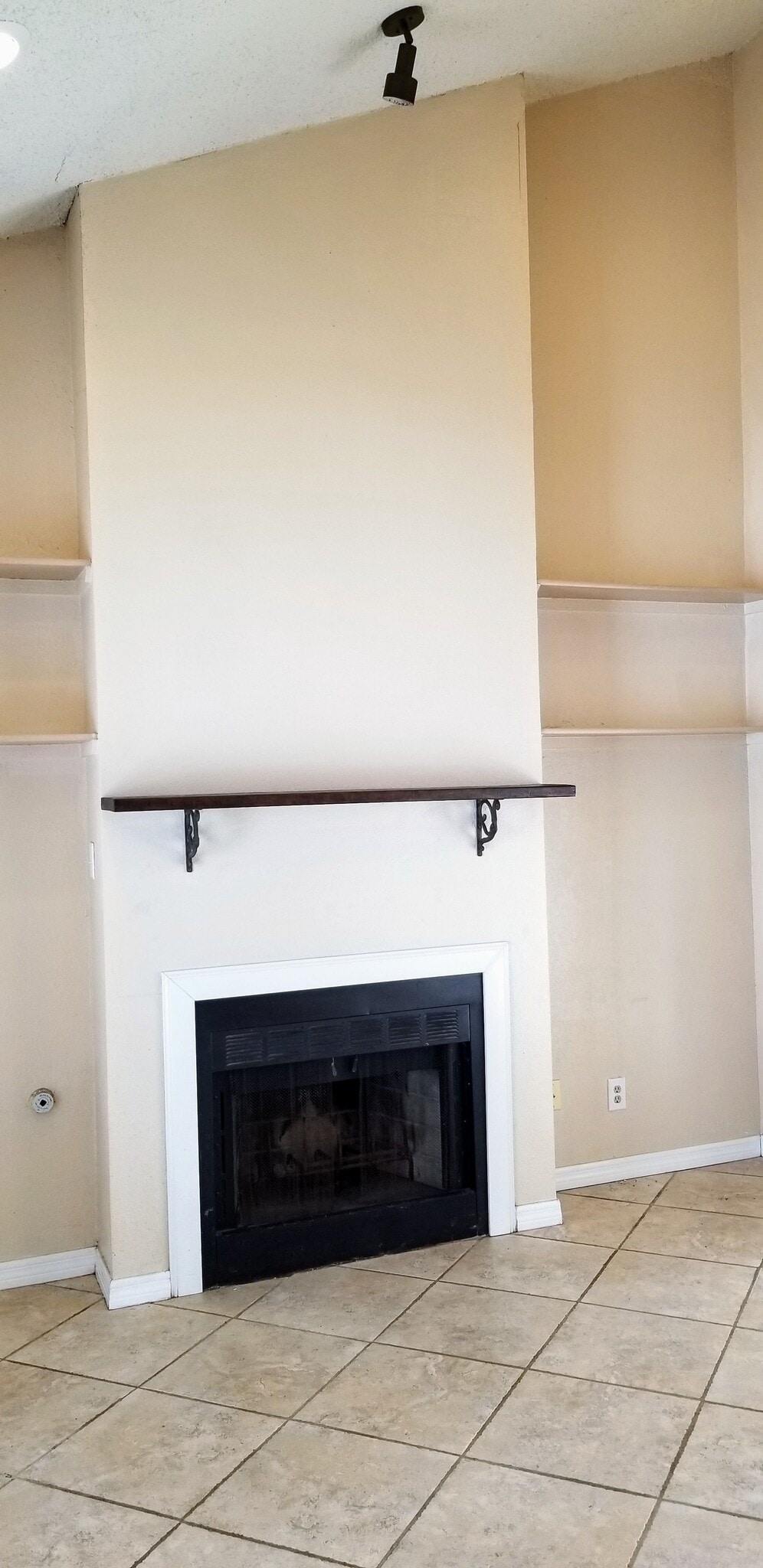 Fireplace close-up with new mantle. - 14519 Clovelly Wood