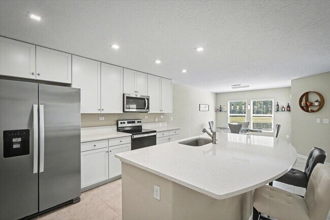 Building Photo - Beautiful Open Layout 4 Bed, 3 Full Bath | A True Masterpiece Backing to a Peaceful Pond with Mod...