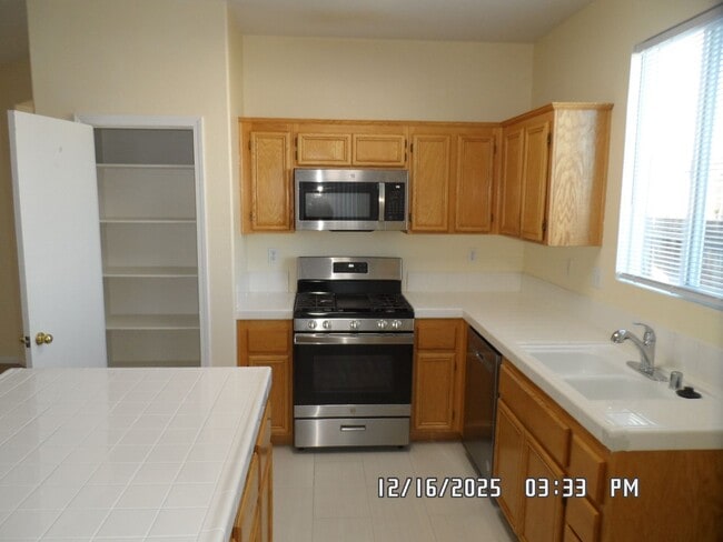 Building Photo - 4 Bedrooms, 2 Bathrooms, 3 Car Garage, 1899 sq. ft., Large Fenced, Front Yard Lawn, Near Schools ...