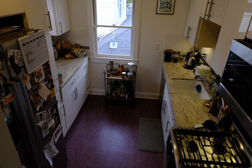 Kitchen includes microwave, dishwasher, gas range and French door fridge - 6026 Harwood Ave