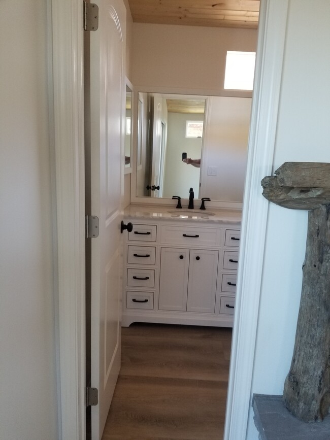 Master on suite bathroom with large stone top vanity and high ceilings - 6832 Zelzah Ave