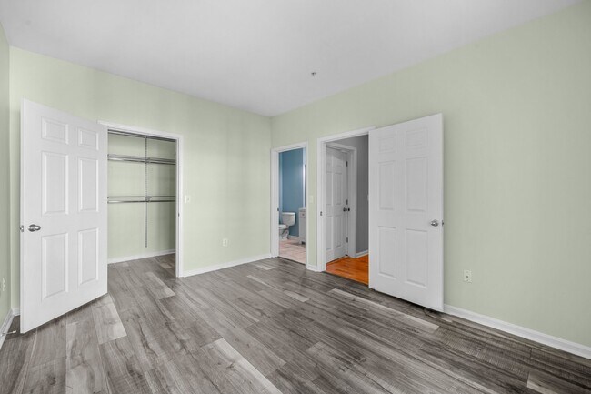 Building Photo - Two-bedroom, two-bathroom model with a den, located on the third floor.