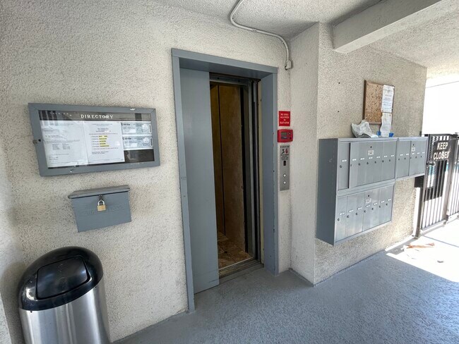 The elevator can get you to the pool or down to the community laundry and parking garage. - 2411 Prospect Ave