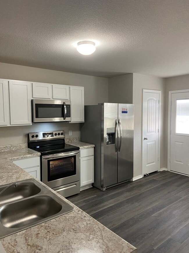 Building Photo - NOW AVAILABLE — Spacious Living in This 4-Bedroom | 2-Bath Conrad Court Home