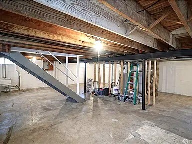 Unfinished basement holds the laundry - 703 N Central Ave
