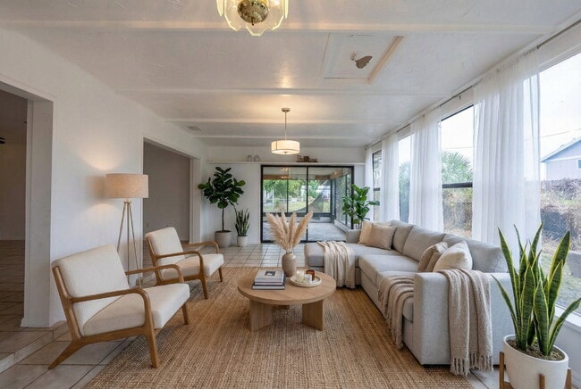 Building Photo - Recently painted 4BR/3BA home with tile floors throughout, fenced yard, detached garage, and prim...