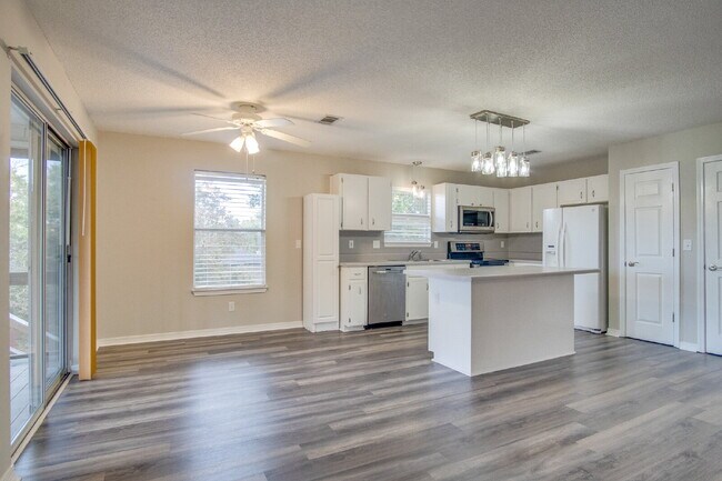 Building Photo - Live the Gulf Breeze Waterfront Life – Dock, Canal Access & Boat Lift!