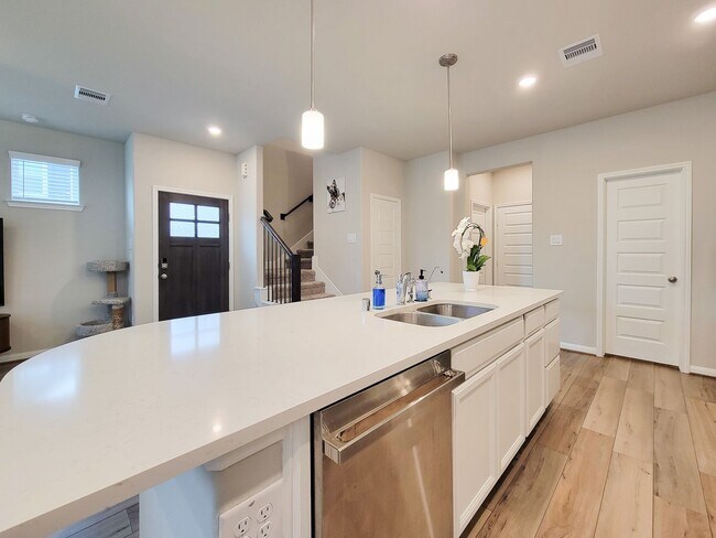 Building Photo - A true gem on a quiet corner lot, this spacious and sun-filled home is tucked away from street no...