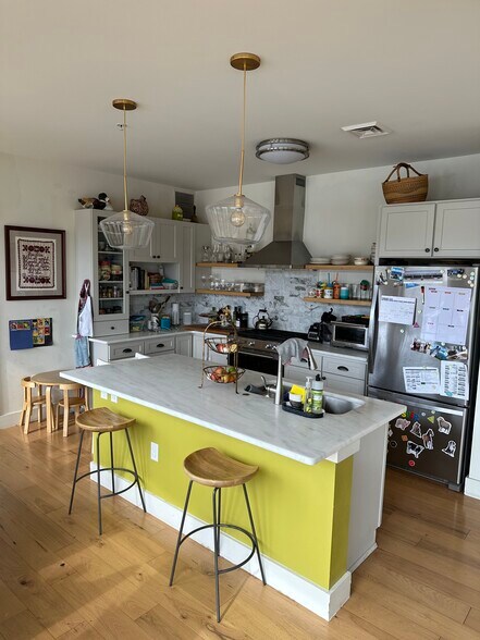 Kitchen with Italian marble island and counters - 60 Winooski Falls Way