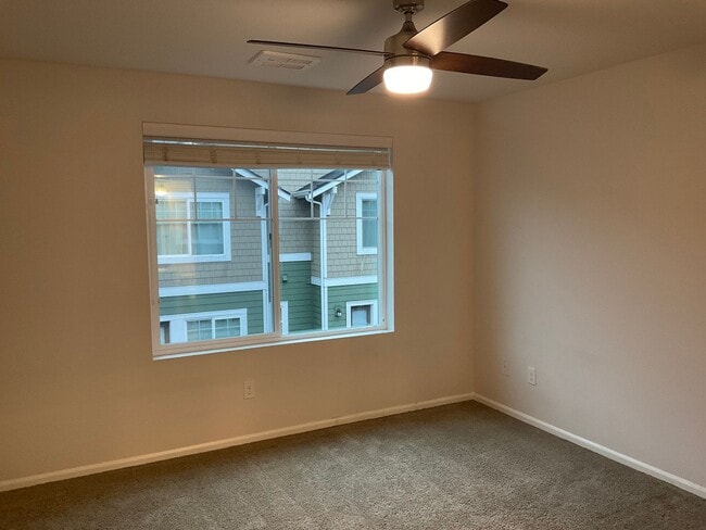 Building Photo - Riverfront Townhome with Tandem Garage & Fenced Yard