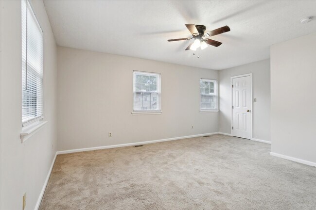 The home offers three spacious bedrooms! - 1644 Skiffes Creek Cir