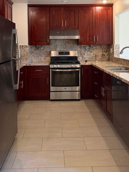 Kitchen with stainless steel appliances - 1042 Hull Ln