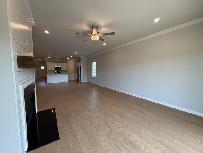 Building Photo - "NEWLY BUILT- Spacious 4-Bedroom Haven with Granite Elegance and Cozy Fireplace in Harvest"