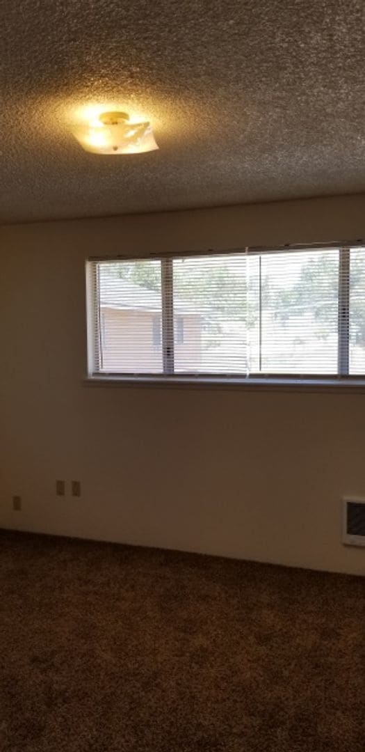 Building Photo - End unit in 8-plex complex