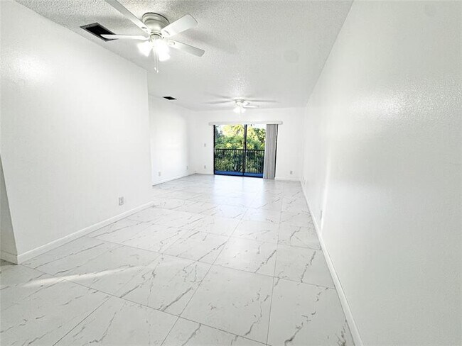 Building Photo - 10687 Royal Palm Blvd