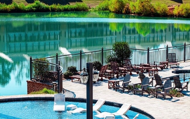 Italian marble tile pool deck overlooking the lake - Wellington Place