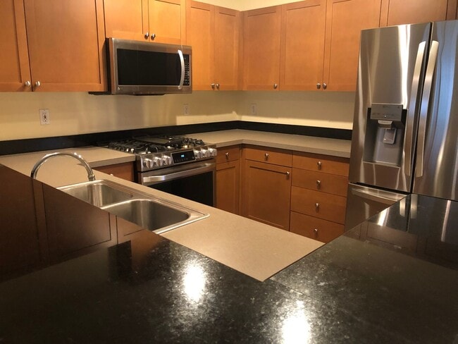 Building Photo - Updated Condo with Parking for One, Great Location and Communal Roof-top Deck!!