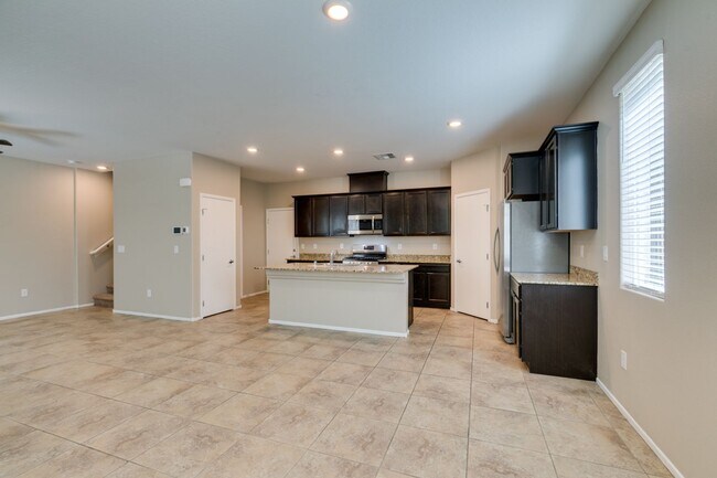 Building Photo - Spacious Townhouse with Loft & Rare 3-Car Garage!