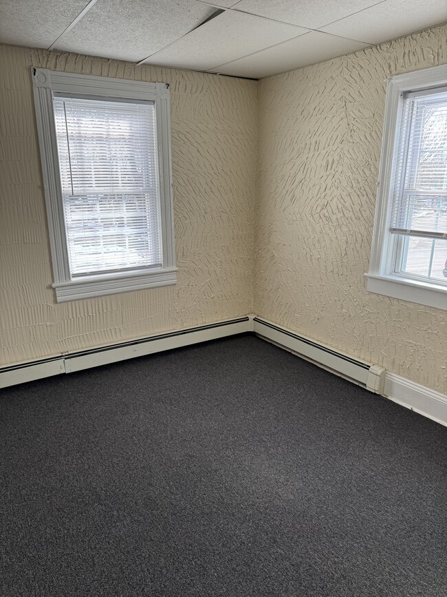 living room with lots of natural light - 88 E Marie St