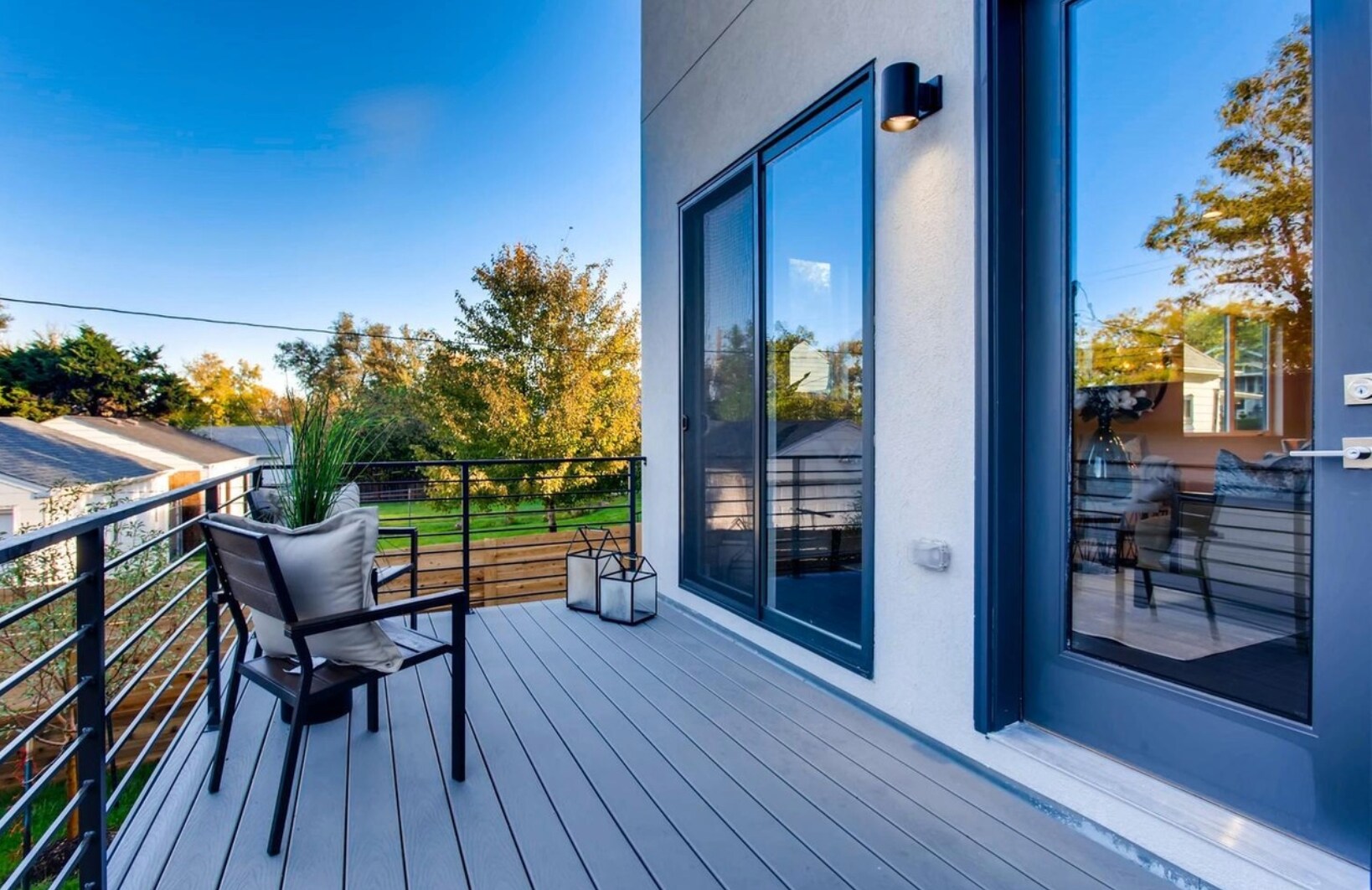 Main floor deck expands living area with a remote controlled awning - 2765 S Sherman St