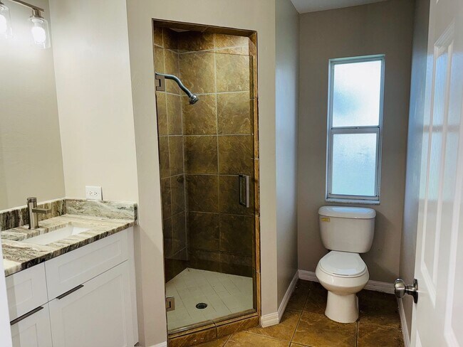 Building Photo - Experience this Cape Coral 3 bedroom 2 bath corner duplex with 1 car garage and screened in lanai.