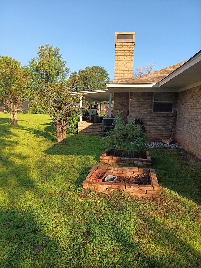 2 garden raised garden beds and back faucet - 2308 Wesley Cir