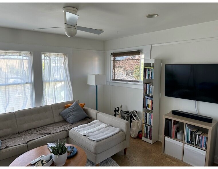 Living Room with Ceiling Fan and AC - 6026 Harwood Ave