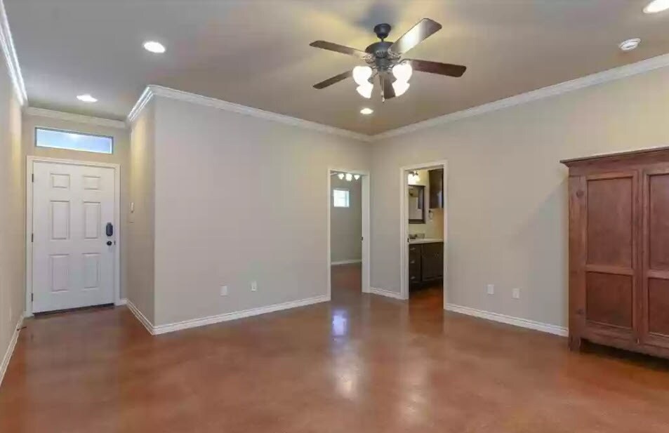 Common living area with concrete flooring - 2912 Old Ironsides Dr