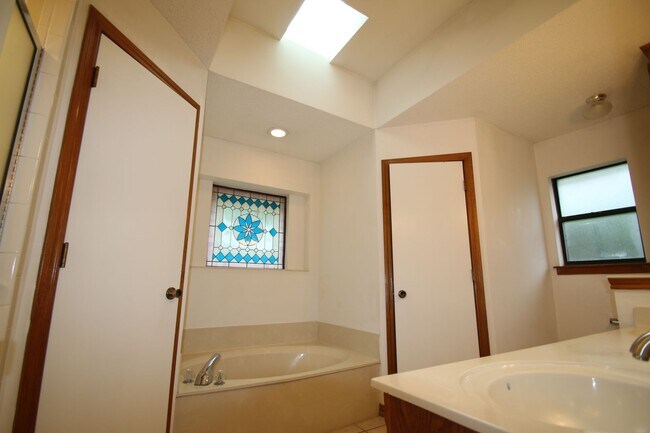 Building Photo - Corner Lot Charmer Off Chapel Creek | 4BR/2BA with Fireplace, Garden Tub & Fenced Backyard