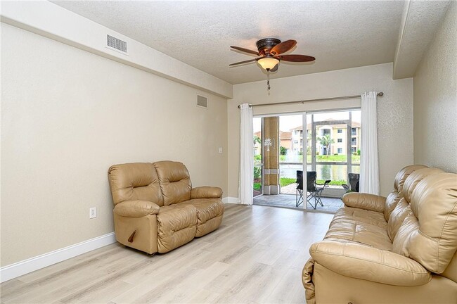 Living room - overlooks lake - 13190 Bella Casa Cir