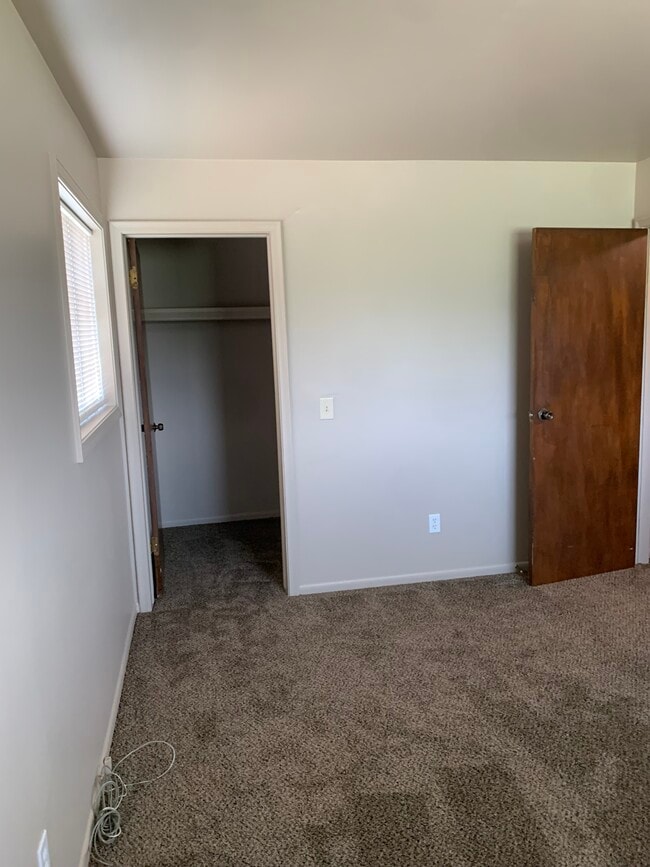 Bedroom 1 with walk-in closet - 4111 Charter Oak Dr