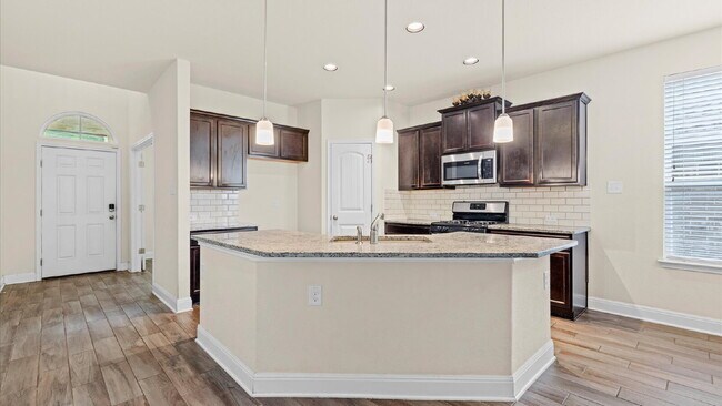 Building Photo - Spacious 4-Bedroom Home with a Backyard Oasis!