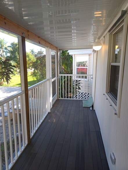 Building Photo - COMING EARLY JUNE: ISLAND LIVING IN BOKEELIA: 1 BD / 1.5 BR Front Screened Lanai