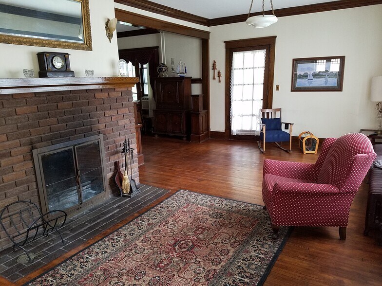 Formal living room with beautiful oak and a warm fireplace - 106 SE 2nd Ave