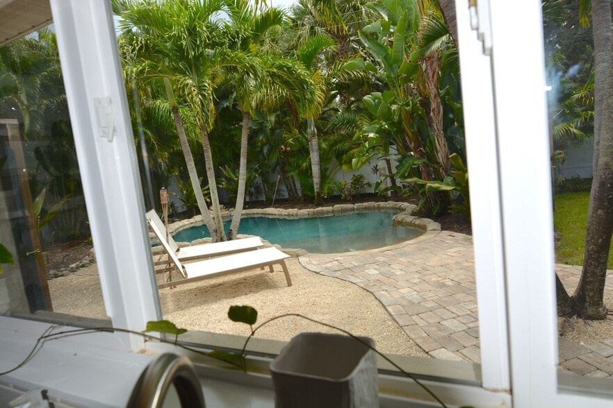 pool view from kitchen sink - 4815 3rd Ave NW