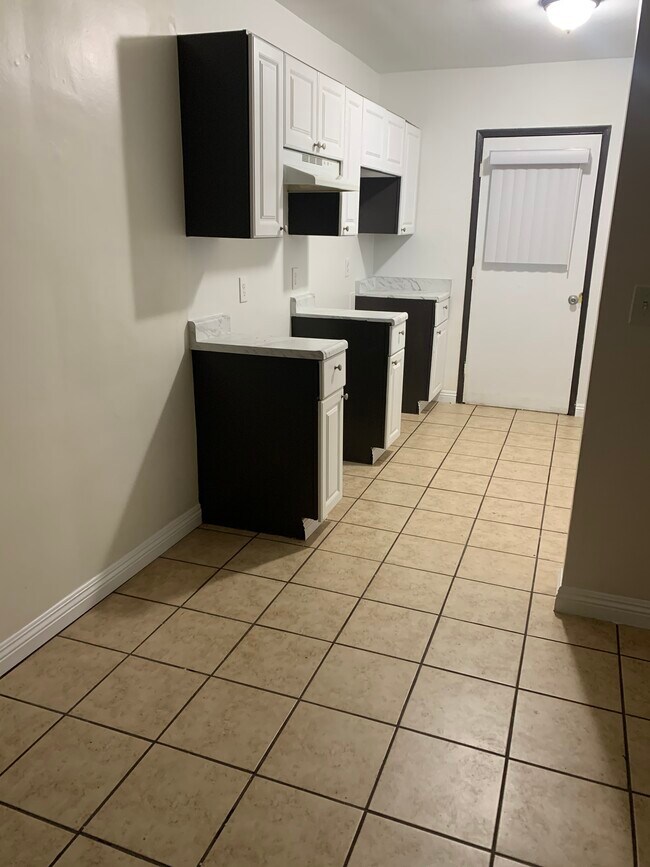 Kitchen tile floor - 14714 Strathern St