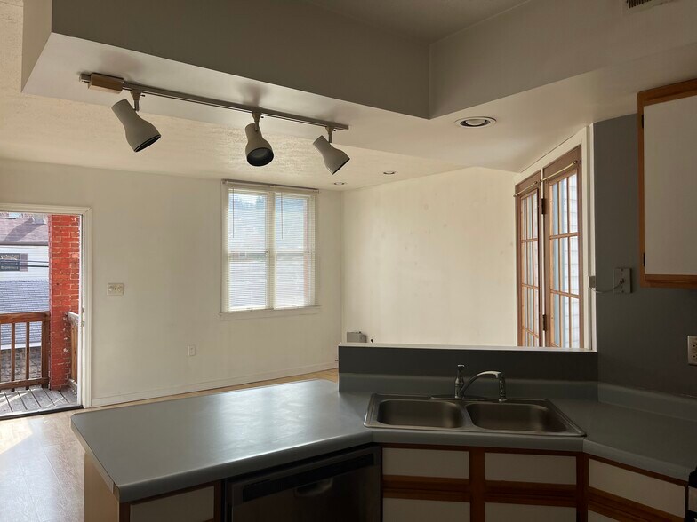 Kitchen to Livingroom and back entrance to Parking Lot - 2328-2 E Carson St