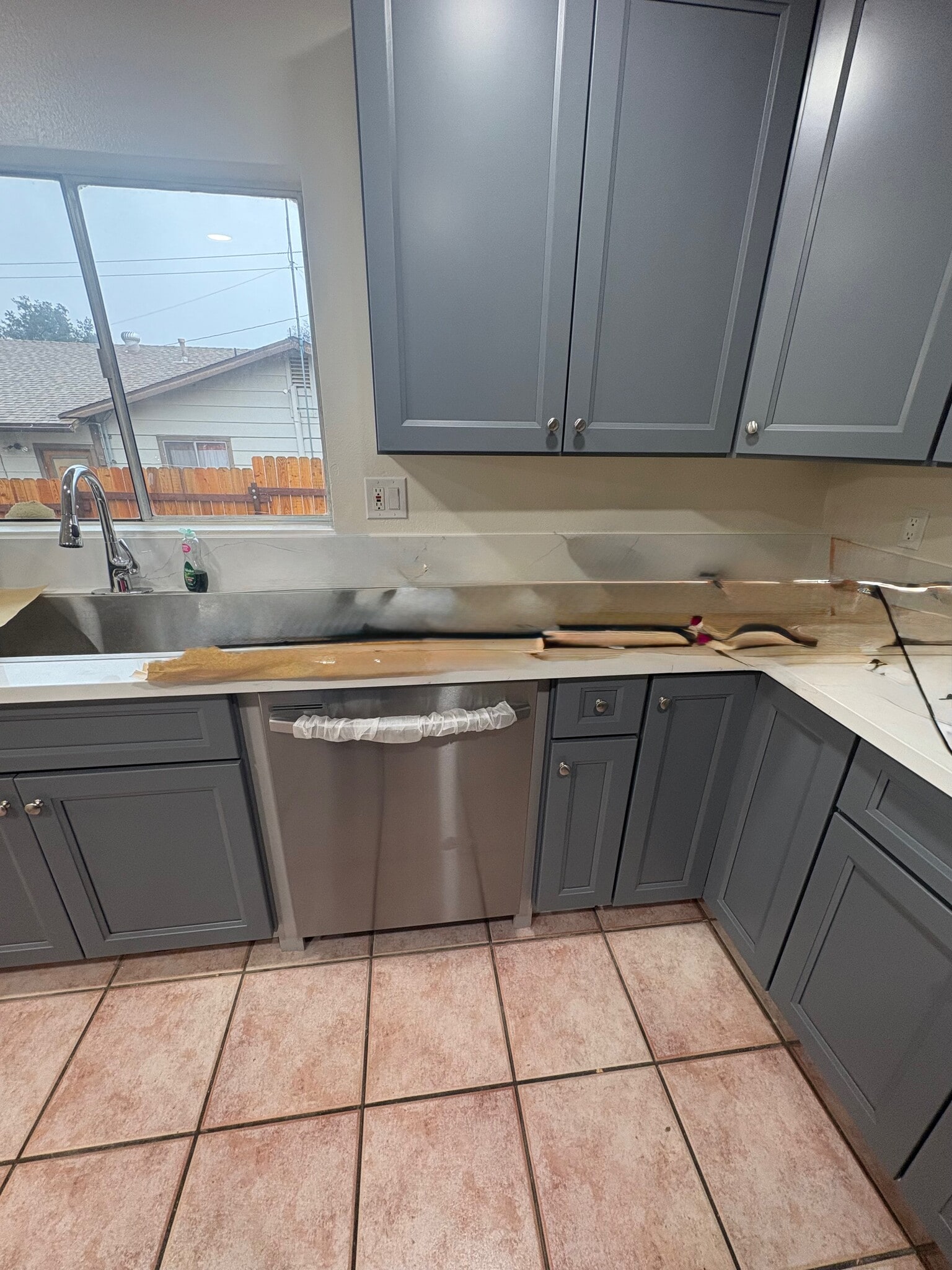 Turning around, the new cabinets, counters dishwasher, sink, garbage disposal - 23162 Smith Rd