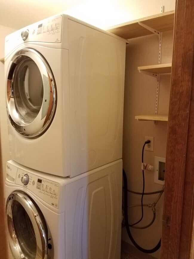 Full size Washer/Dryer with lots of storage in utility room. - 3031 E 42nd Ave