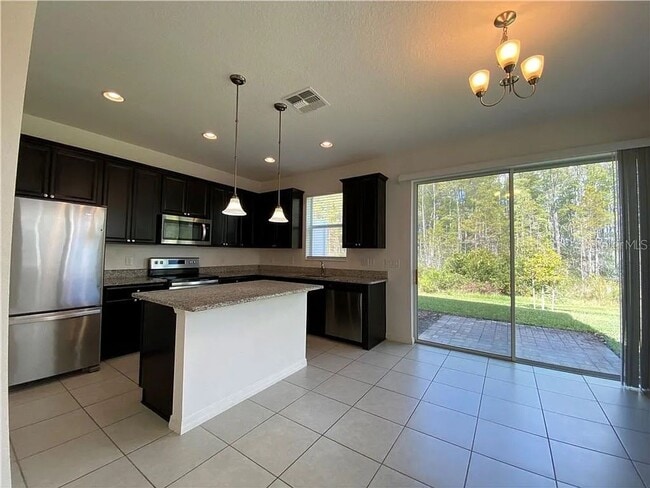 Building Photo - Beautiful End Unit Townhome Near Lake Nona w/ 2-Car Garage & Conservation Views!