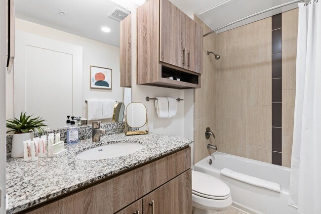 Building Photo - Midtown Magic: Big Savings + Big Perks!