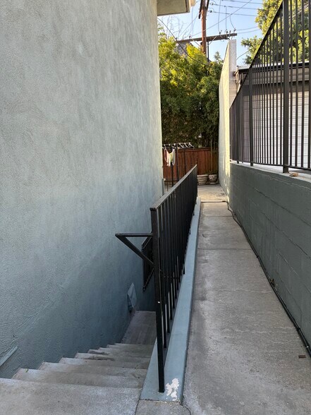 Stairwell to gated garage and community Laundry - 1520 Spruce St