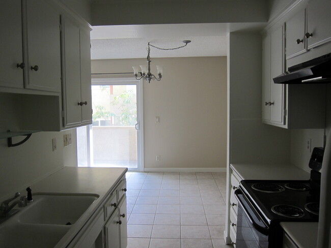 Dining area through kitchen - 1242 S Barrington Ave