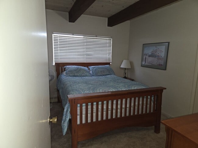 Building Photo - Unique open design,wood beams in all rooms-Very cheery and cozy. Newly remodeled, and newly furni...