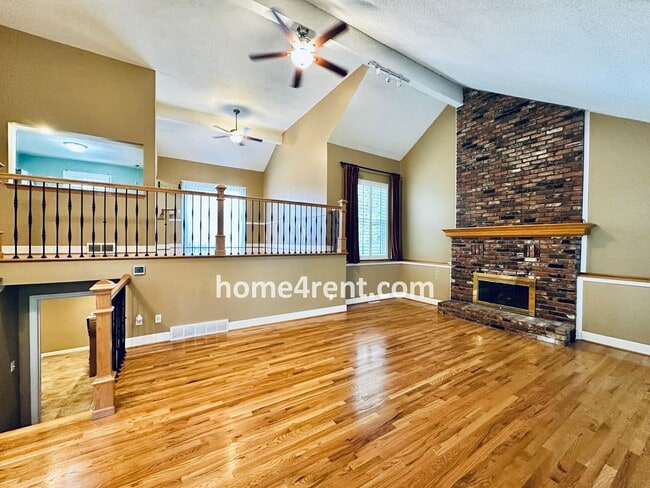 Building Photo - A Lovely Lenexa Home w/ Wood Floors Throughout, Updated Kitchen, Finished Basement and a Fenced Y...