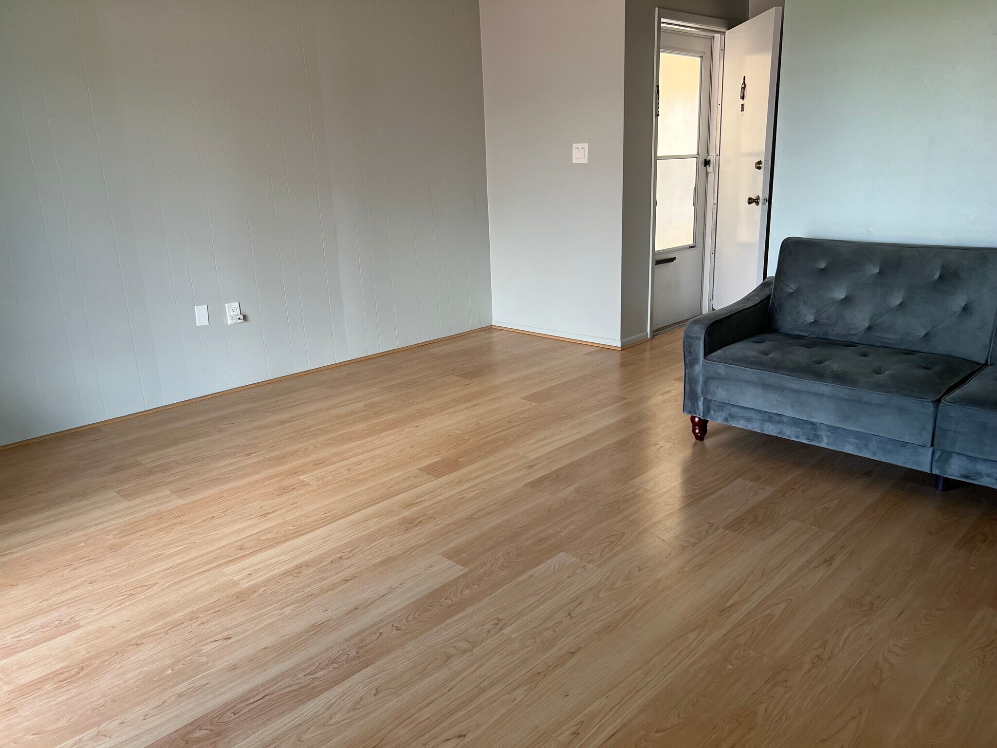 Another view of living room with entry hall and front door in right background. - 3535 41st Ter S