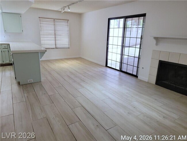 Building Photo - The Lakes Home with No Carpet, Fireplace & Covered Patio