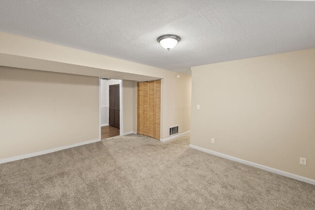 Building Photo - Spacious Split-Level Home with Finished Basement, Deck, Fenced Yard & 2-Car Garage